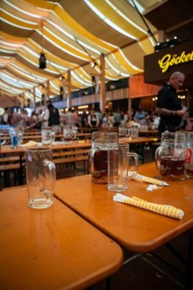Empty beer mugs on a table in a large marquee during a party, Canstatter Wasen, Stuttgart, Germany,