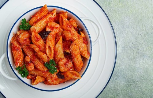 Penne pasta, with shrimp in tomato sauce, close-up, no people