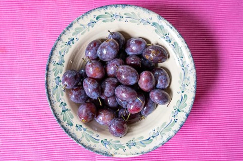 Fresh plums (Prunus domestica) in a bowl, Bavaria, Germany, Europe