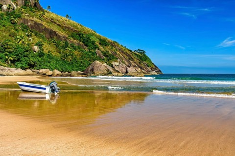 Speedboat on the sand of Bonete beach on the island of Ilhabela on the coast of Sao Paulo,