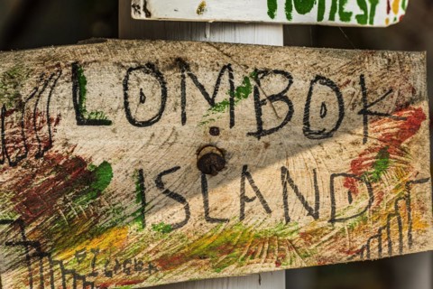 Wooden sign, hand-lettered, holiday, travel, exotic, tourism, handmade, Asian, Lombok, Indonesia,