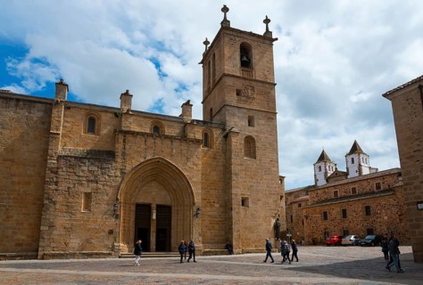 Large square with Gothic church and historic buildings under a blue sky, Cathedral, Concathedral,