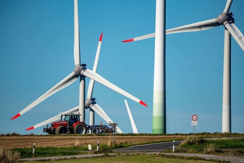 Wind farm near Lichtenau, wind turbines, country road, Driburger Straße, tractor at work in the