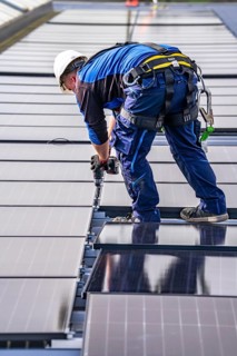 Installation of solar modules on the roof of a commercial enterprise, over 400 photovoltaic modules