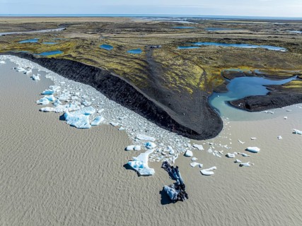 Aerial view over the glacial lake Fjallsárlón, glacier Fjallsjökull, part of Vatnajökull glacier,