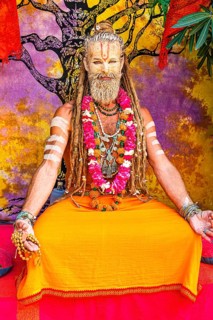 Guru performer in traditional painting and clothing at the hippie market in Es Canar, Ibiza,
