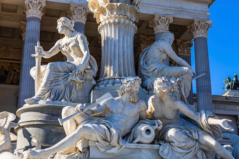 Stone figures of the Pallas-Athena fountain in front of the parliament building, Vienna, Austria,