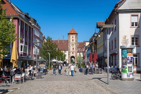 Pedestrian zone, shopping street with the Obertor, historic town gate of Villingen,