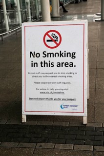 No smoking area sign, Stansted airport, Essex, England, UK
