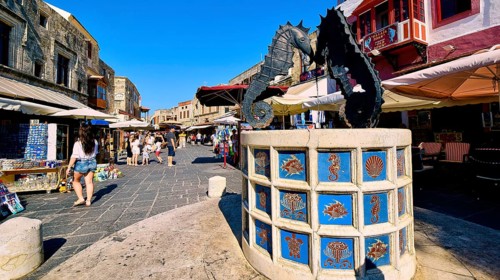 Martyrs Square, Lively market square with a fountain showing seahorse statues, surrounded by shops