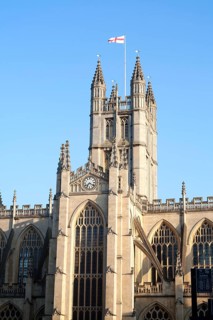 English flag flying on the tower of the Abbey church, Bath, Somerset, England, UK