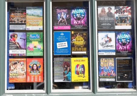 Poster display of forthcoming events and performances, Regent theatre, Ipswich, Suffolk, England,