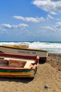 Fishing boats on a pebble beach, surf, Cabo de Gata Natural Park, Las Negras, Almeria, Andalusia,