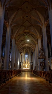 Rays of sunlight flood the quiet interior of St Martin's Basilica, Amberg, Upper Palatinate,