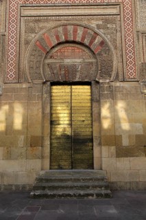 Moorish doorway arch elaborately inscribed stonework of the mezquita Great Mosque, Cordoba, Spain,