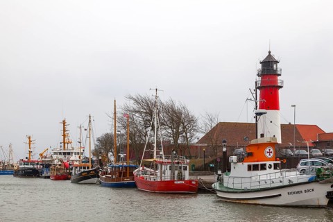 Büsum fishing harbour with lighthouse, Büsum, North Sea, Schlewig-Holstein, Germany, Europe