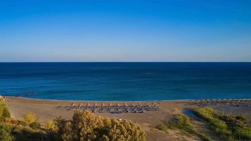 Beach, wetland, umbrellas, sun loungers, green-blue sea, blue cloudless sky, Frangokastello,