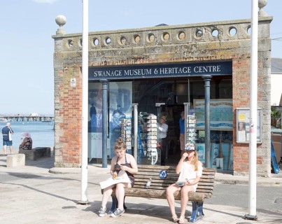 Museum and Heritage centre Swanage, Dorset, England, UK two girls eating chips