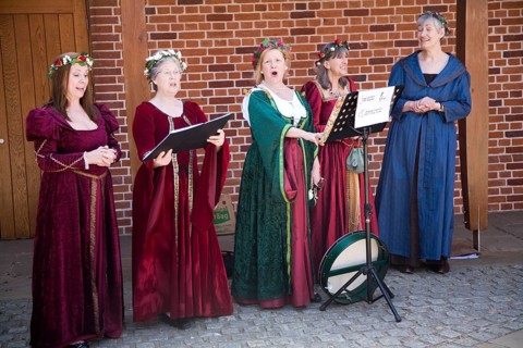 Sweet Harmonie female singing group in Tudor costume performing at Layer Marney Tower, Essex,