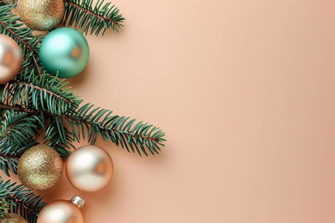 Christmas flatlay with blue and cream colored tree baubles and fir branches on beige background