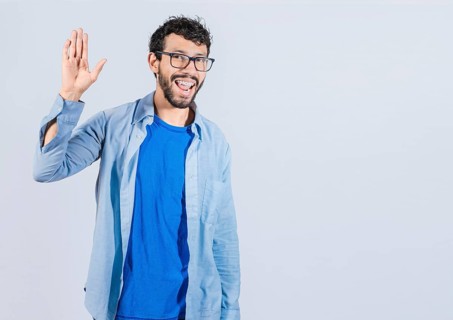 Handsome man gesturing and saying hi isolated. friendly person saying goodbye