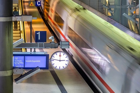 Platform at Gesundbrunnen station with an ICE train passing through: Caution train traffic sign.