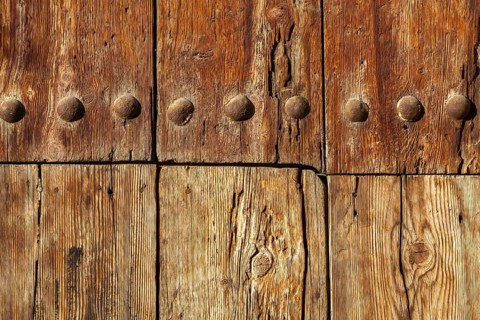 Close-up of an old solid wooden door with metal rivets, Granada, Andalusia, Spain, Europe