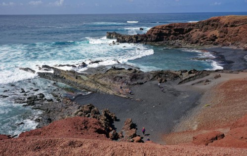 Lava rocks at the Playa de los Ciclos near the Green Lake, Lago Verde, El Golfo, Lanzarote, Canary