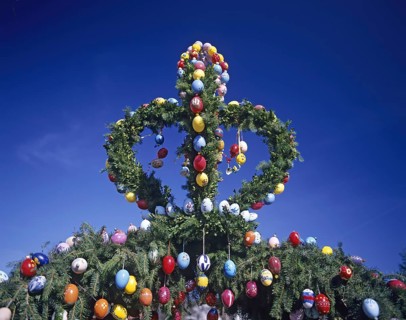 A traditionally decorated Easter tree with colourful Easter eggs under a clear blue sky, Franconian