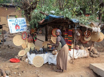 Amhara region, in the Falasha village of Wolleka near Gondar, Gonder, woman selling home-made