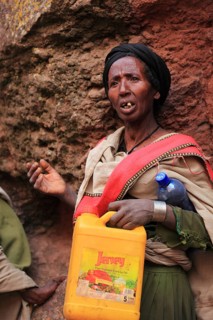 Pilgrim at the rock-hewn churches in Lalibela, container for holy water, Ethiopia, Africa