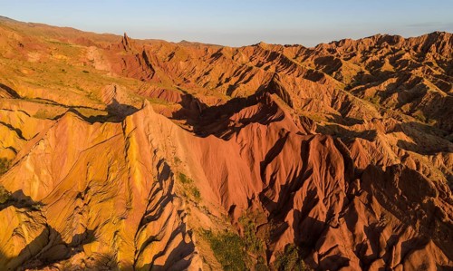 Aerial view, eroded mountain landscape, sandstone cliffs, canyon with red and orange rock