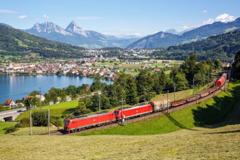 DB Cargo railway goods train on the Großer Mythen mountain on Lake Zug in the Alps in Arth,