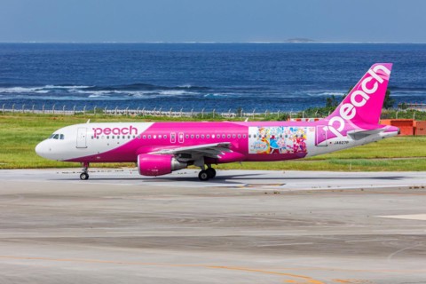 A Peach Airbus A320 aircraft with the registration JA827P in the Soaring Sky Pretty Cure special