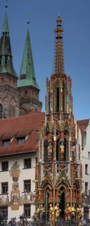The 19 metre high Schöne Brunnen fountain on the Hauptmarkt is a copy made of shell limestone in
