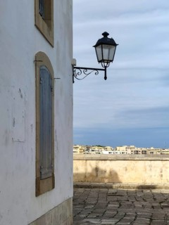 Street lamp on the corner of a house, old town centre, Otranto, Apulia, Italy, Europe