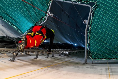 Height rescuers from the Oberhausen professional fire brigade practise abseiling from a wind