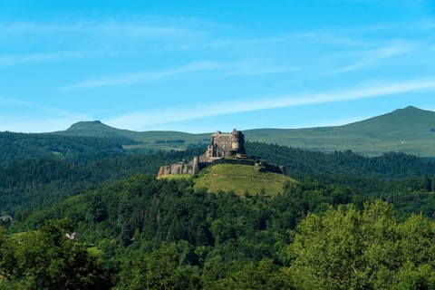 View of the medieval castle of Murol in the Auvergne Volcanoes Regional Natural Park, Puy de Dome,