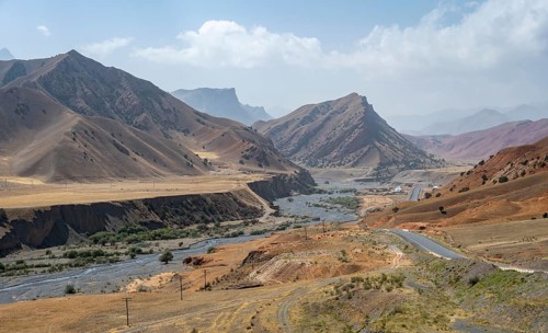 Pamir Highway, mountain road through eroded mountain landscape, Kyrgyzstan, Asia