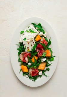 Salad, melon with prosciutto, arugula, and cheese, summer salad, vegetarian, homemade, no people