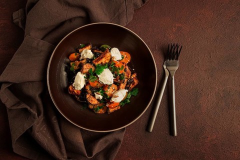 Warm Salad with crispy eggplant and tomatoes, cottage cheese, spices, herbs, sesame seeds,