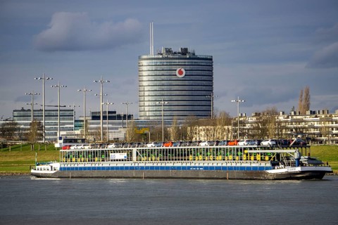 The Rhine at Neuss Vodafone building, cargo ship, vehicle transporter Fuerte, of BLG Autotransport