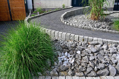 Modern front garden with paved path and stones, gravelled garden, Ruhr area, North