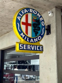 Old historic neon sign with coat of arms and Alfa Romeo Milano lettering, Classic Remise,