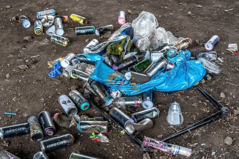 Paint cans, leftover rubbish from graffiti sprayers, under the motorway bridge, the A43 over the