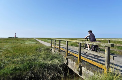 Cycling at the Westerheversand lighthouse, Schleswig-Holstein, Germany, Europe
