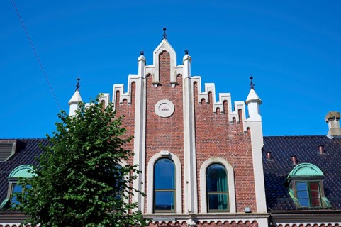 Historic Hanseatic house with striking façade under a clear blue sky, Bryggen, Bergen, Vestland,