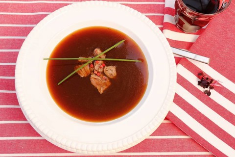 Southern German cuisine, oxtail soup with red pepper in a soup plate, bound soup, meat soup,