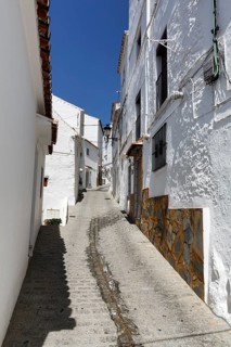 Typical white village Casares, houses, narrow alley on a hill, Route of the white villages, Malaga,