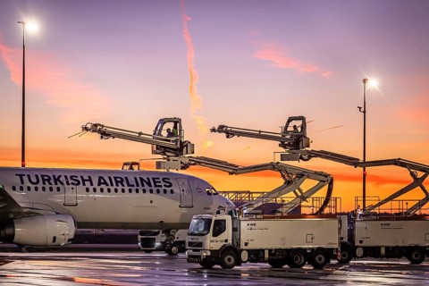 Frost at the airport, a Turkish Airlines aircraft is de-iced in front of sunrise. Airbus A321-231,